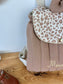 Set includes: Toiletry bag, blanket, doll, notebook cover, and bonnet 