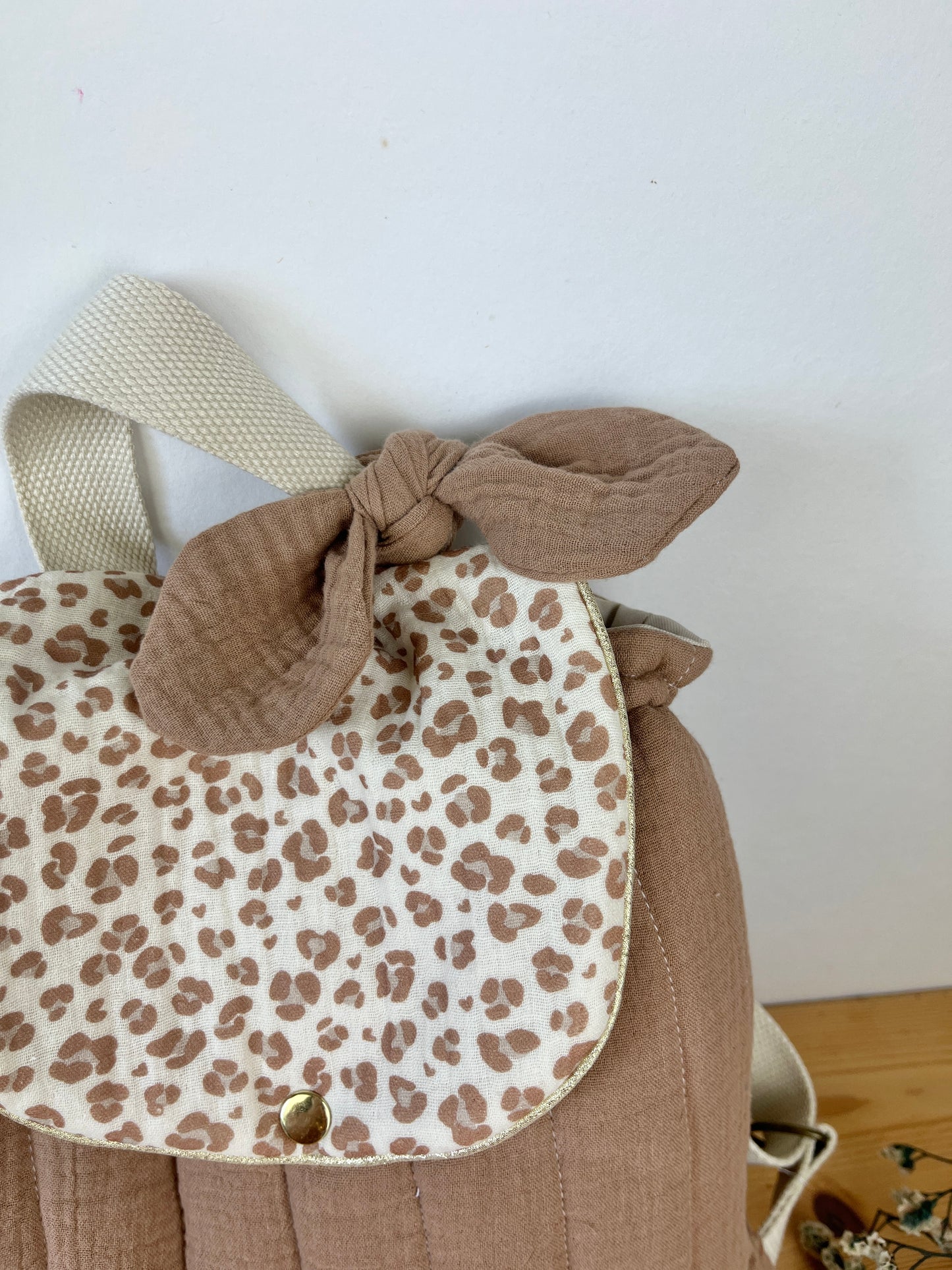 Set includes: Toiletry bag, blanket, doll, notebook cover, and bonnet 