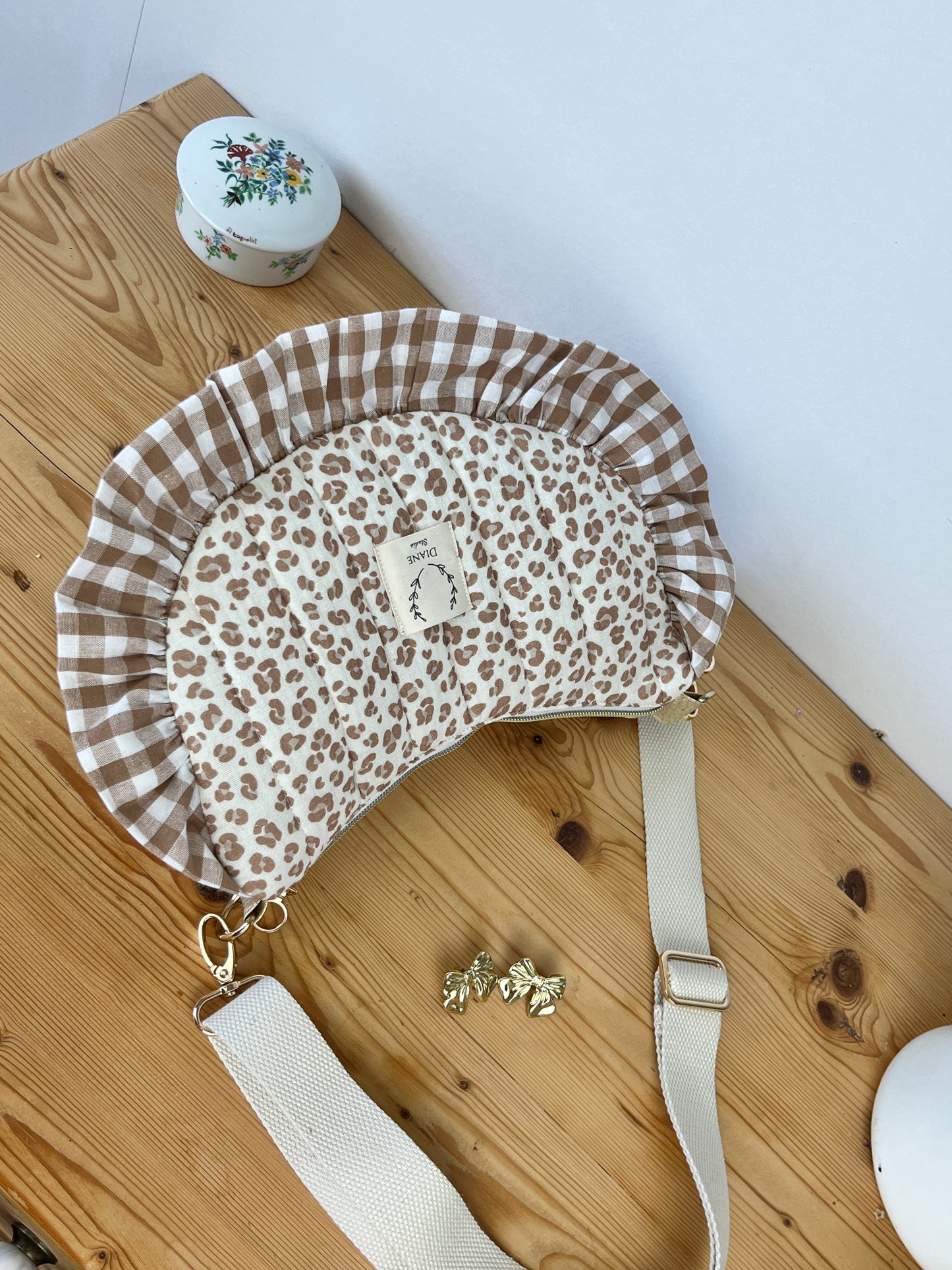 Set includes: Toiletry bag, blanket, doll, notebook cover, and bonnet 