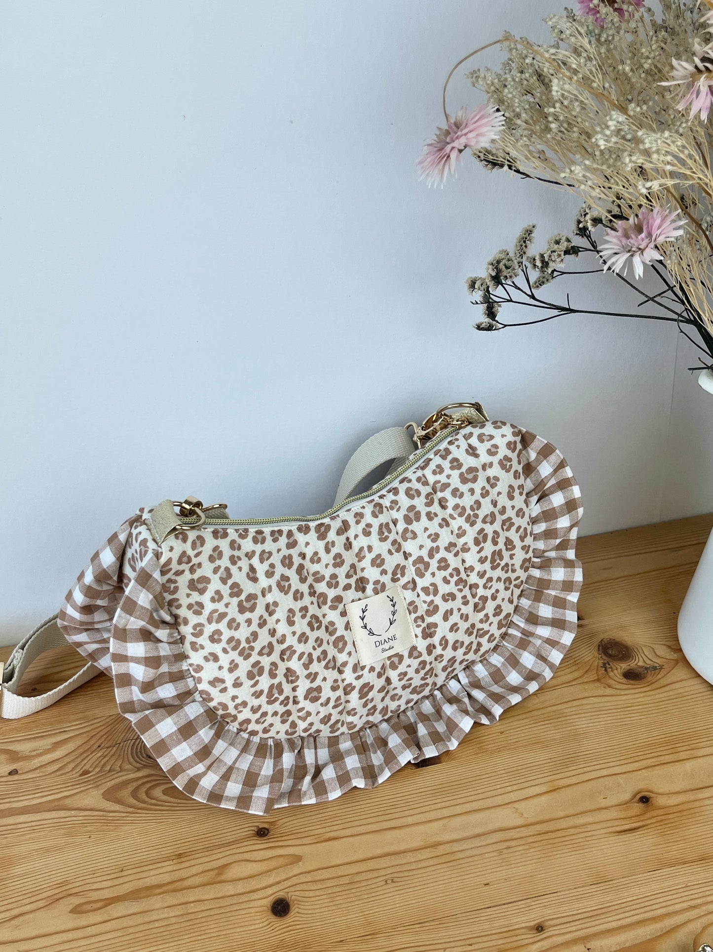 Set includes: Toiletry bag, blanket, doll, notebook cover, and bonnet 