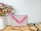 Charlotte quilted clutch bag in double floral gauze