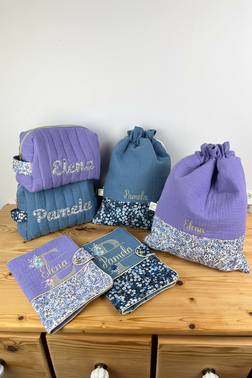 Set includes: toiletry bag, doll, notebook cover and embroidered pouch 