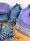 Set includes: toiletry bag, doll, notebook cover and embroidered pouch 