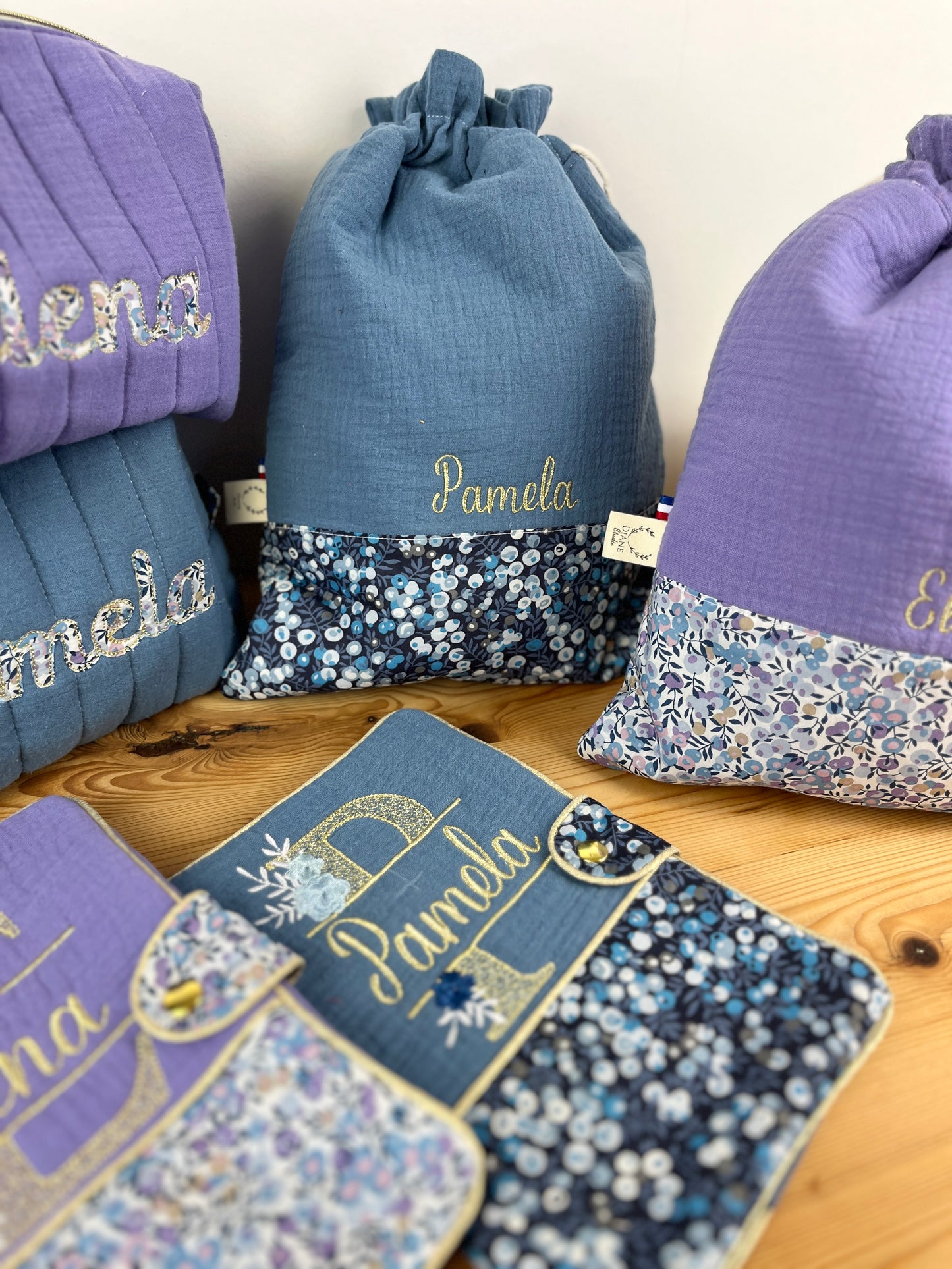 Set includes: toiletry bag, doll, notebook cover and embroidered pouch 