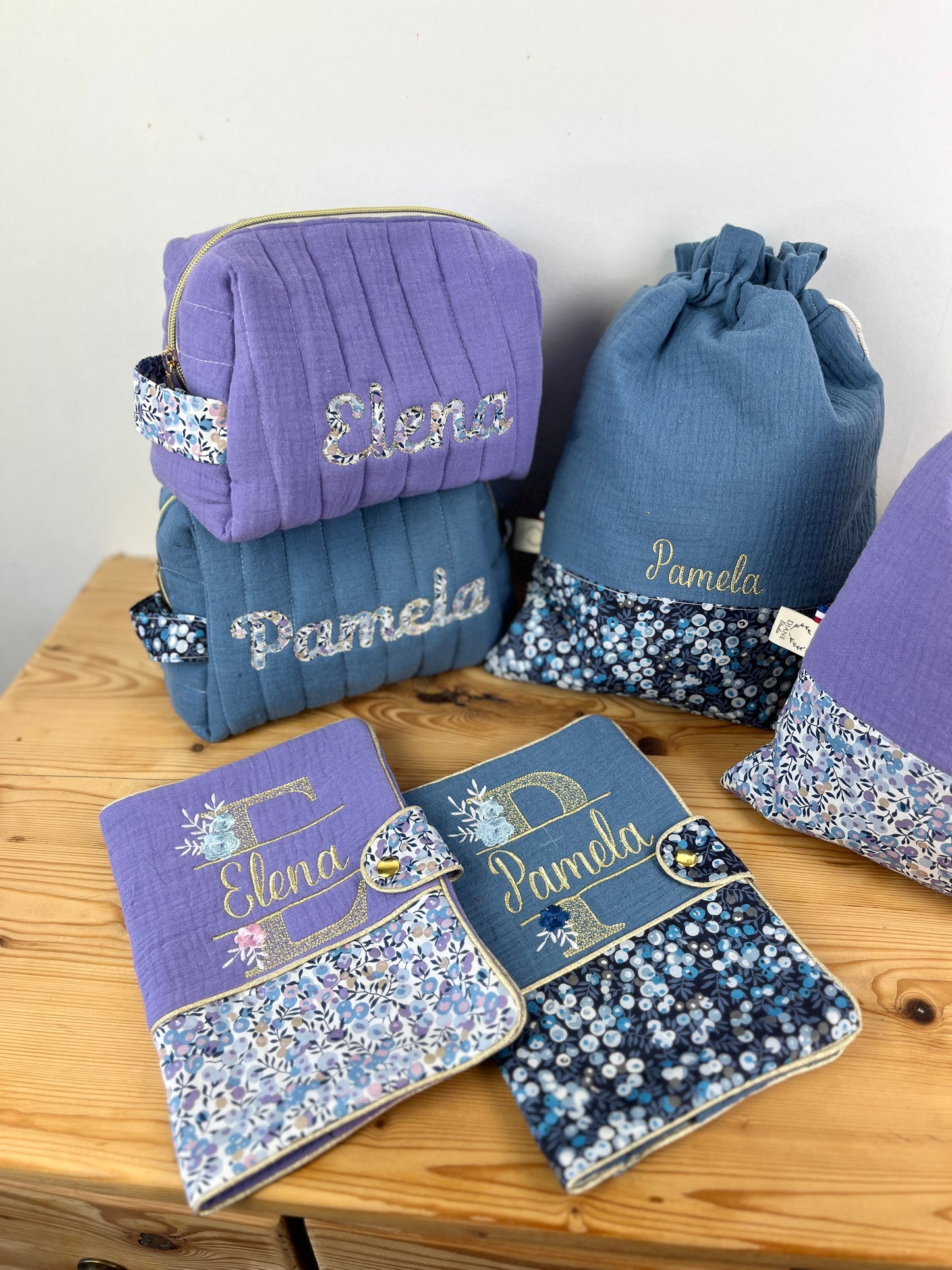 Set includes: toiletry bag, doll, notebook cover and embroidered pouch 