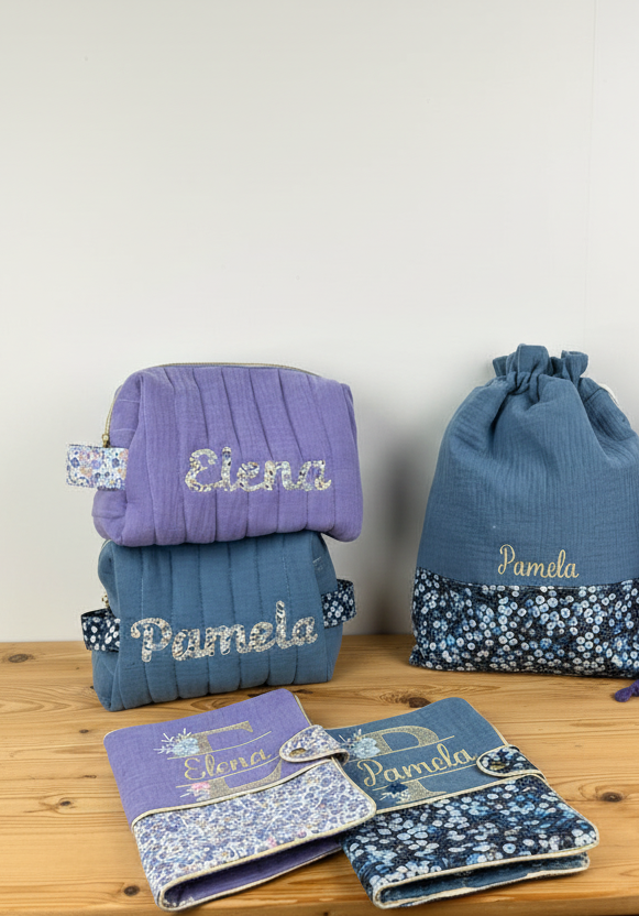Set includes: toiletry bag, doll, notebook cover and embroidered pouch 
