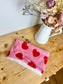 Children's neck warmer with red hearts