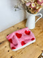 Children's neck warmer with red hearts