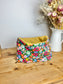 Children's poppy neck warmer with green background and glittery interior