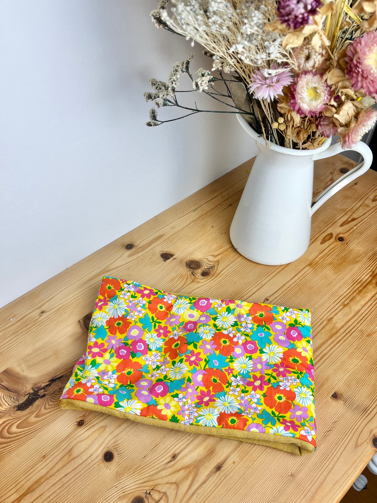 Children's poppy neck warmer with yellow background and glittery interior