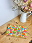 Children's poppy neck warmer with yellow background and glittery interior