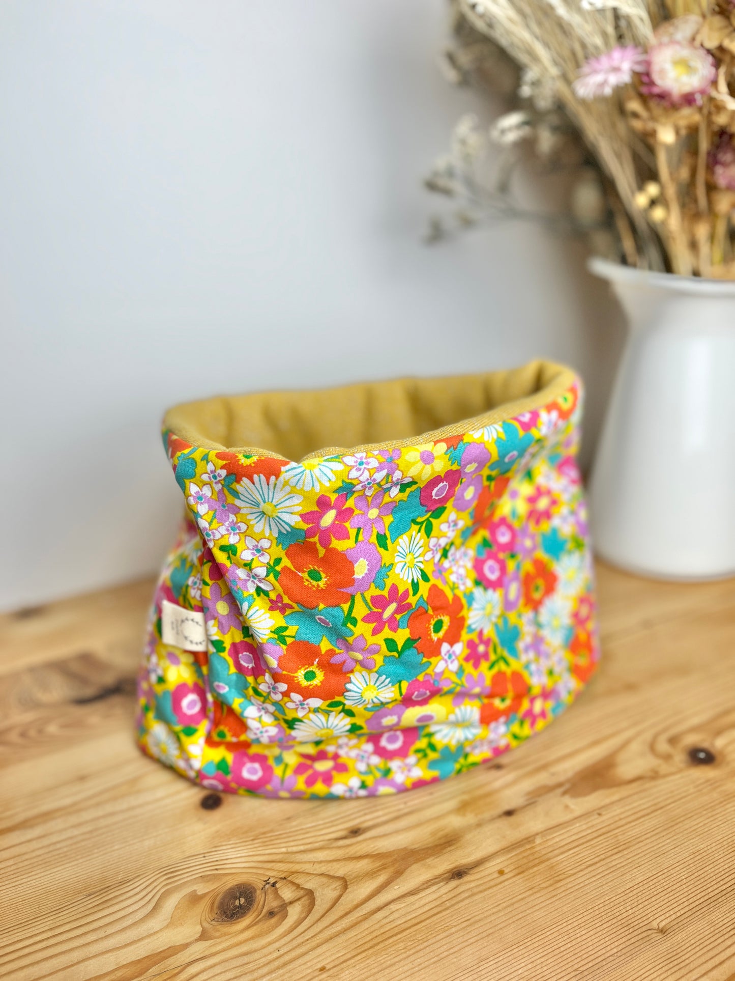 Children's poppy neck warmer with yellow background and glittery interior