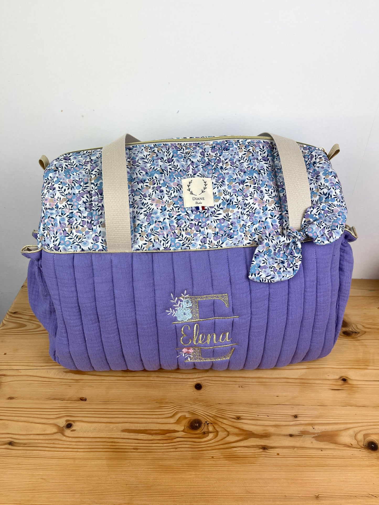 Set includes: Diaper bag, toiletry bag, doll, notebook cover, pouch and bonnet 