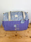 Set includes: Diaper bag, toiletry bag, doll, notebook cover, pouch and bonnet 