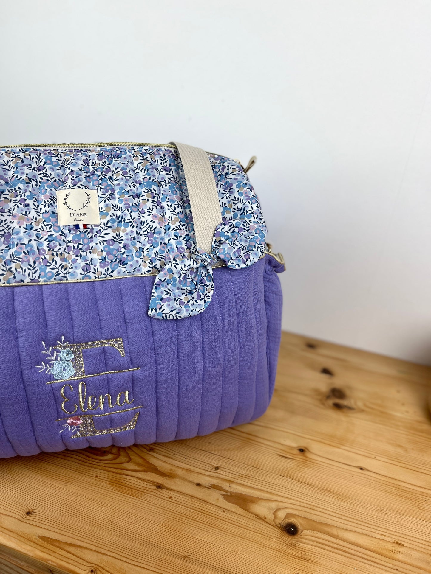 Set includes: Diaper bag, toiletry bag, doll, notebook cover, pouch and bonnet 