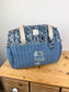 Set includes: Diaper bag, toiletry bag, doll, notebook cover, pouch and bonnet 
