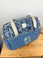 Set includes: Diaper bag, toiletry bag, doll, notebook cover, pouch and bonnet 