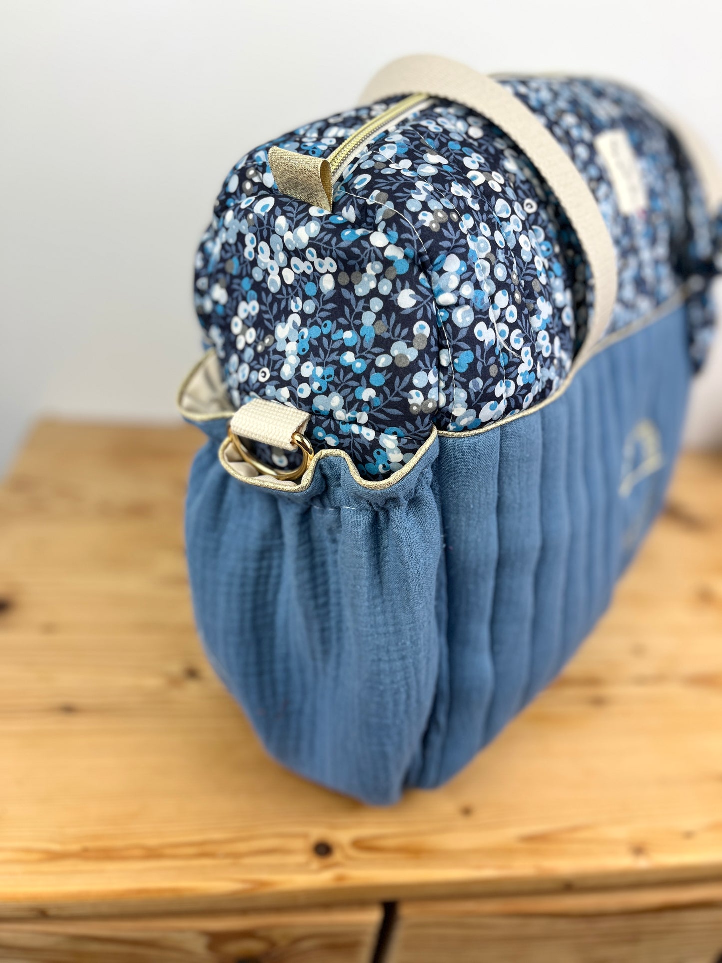 Set includes: Diaper bag, toiletry bag, doll, notebook cover, pouch and bonnet 