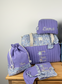 Set includes: Diaper bag, toiletry bag, doll, notebook cover, pouch and bonnet 