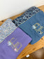 Set includes: Diaper bag, toiletry bag, blanket, doll, notebook cover, pouch and bonnet 