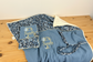 Set includes: Toiletry bag, blanket, doll, notebook cover, and bonnet 