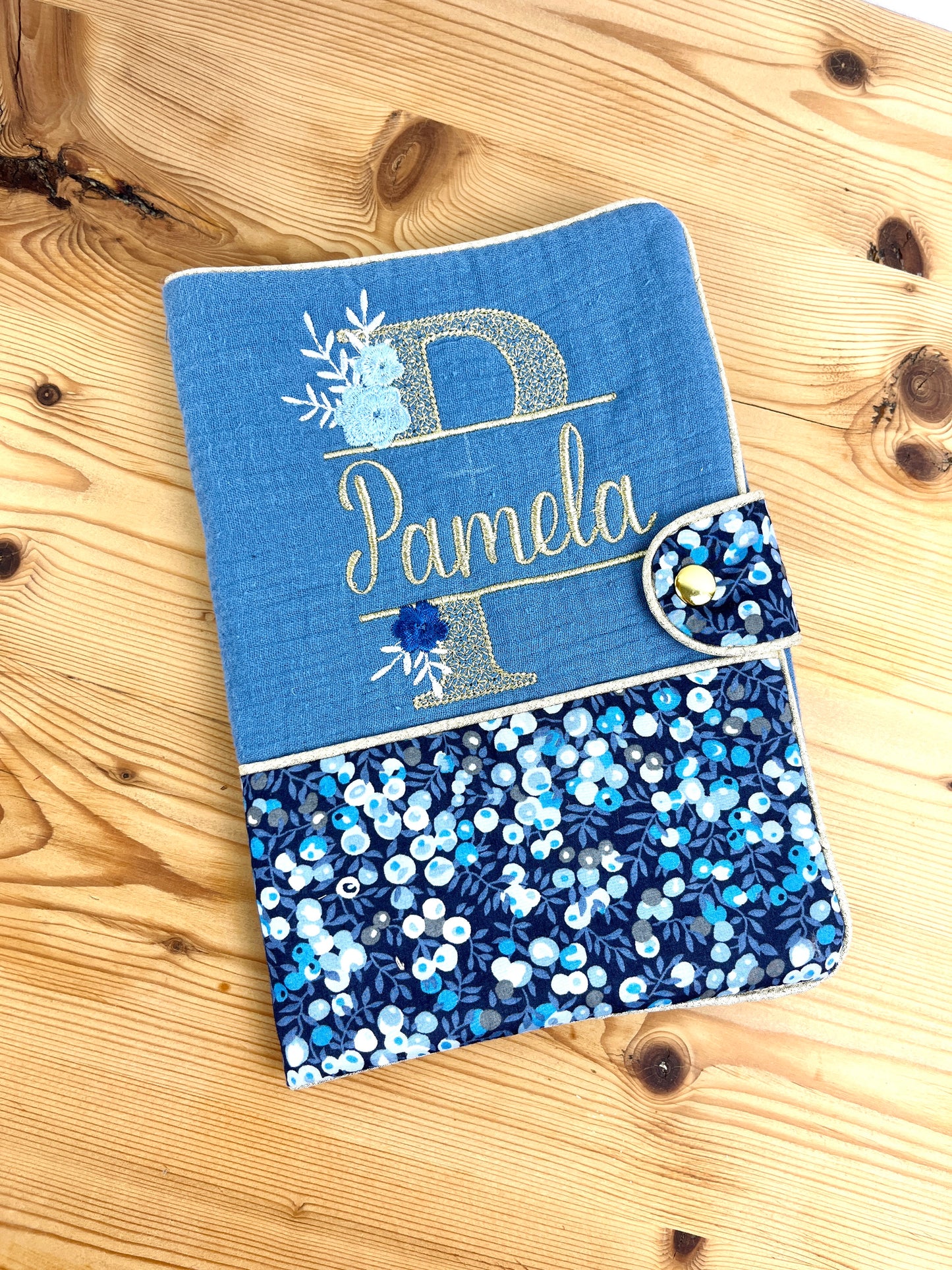 Set: baby bonnet and health record book cover 