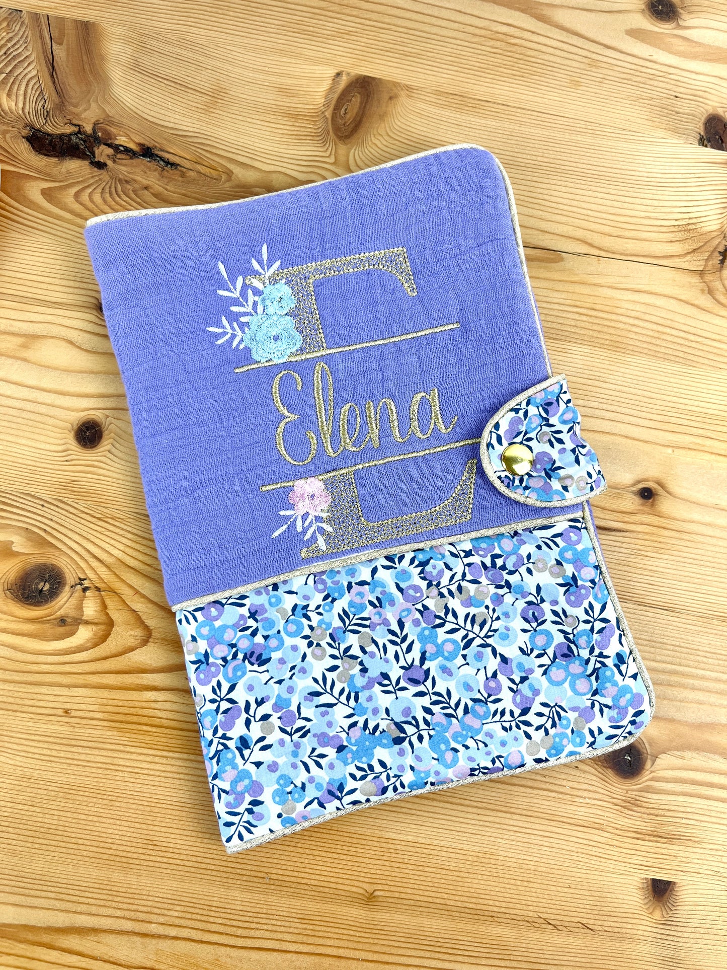 Set: baby bonnet and health record book cover 
