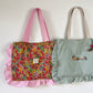 The small ruffled tote bag is 100% customizable.